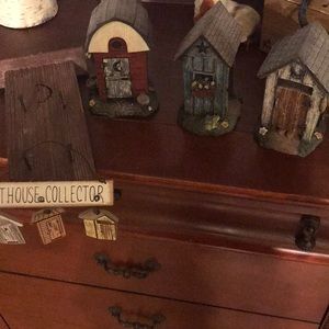 Set of 3 ceramic outhouses and 2 outhouse signs.